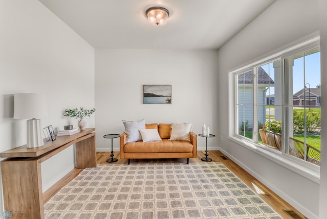 6176 Marigold Loop S, Fargo, ND 58104 - sitting room with wood finished floors and baseboards