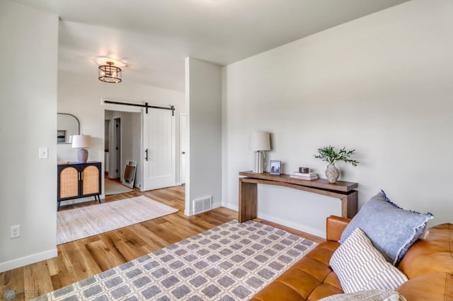 6176 Marigold Loop S, Fargo, ND 58104 - living room with a barn door and wood finished floors