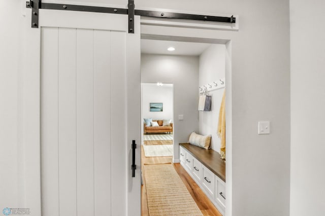 6176 Marigold Loop S, Fargo, ND 58104 - mudroom featuring light wood-type flooring and a barn door