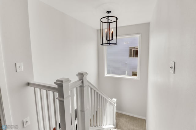 6176 Marigold Loop S, Fargo, ND 58104 - staircase with a chandelier and baseboards