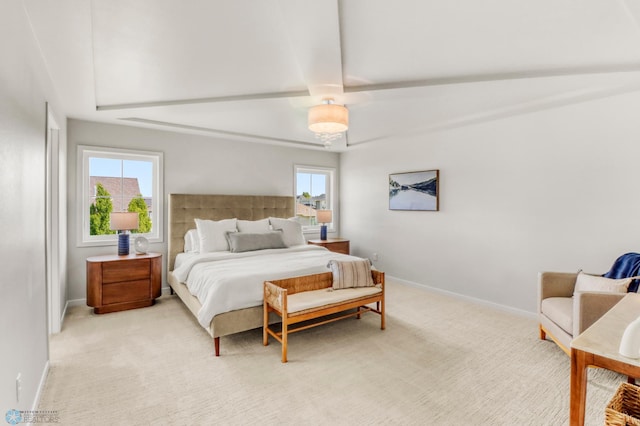 6176 Marigold Loop S, Fargo, ND 58104 - bedroom with multiple windows, light carpet, and beam ceiling