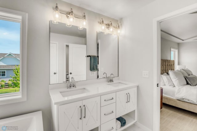 6176 Marigold Loop S, Fargo, ND 58104 - bathroom featuring double vanity and ensuite bathroom
