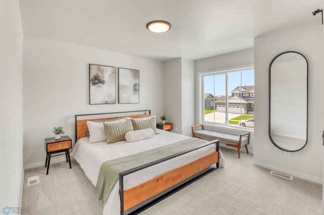 6176 Marigold Loop S, Fargo, ND 58104 - bedroom with baseboards and light carpet