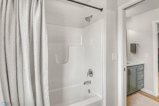 6176 Marigold Loop S, Fargo, ND 58104 - full bathroom featuring shower / bathtub combination with curtain, vanity, and wood finished floors