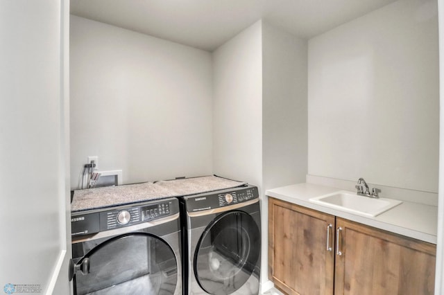6176 Marigold Loop S, Fargo, ND 58104 - laundry room featuring washer and dryer and cabinet space