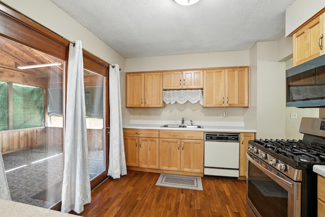 1958 6th St N, North Saint Paul, MN 55109 - kitchen featuring gas range, white dishwasher, black microwave, light countertops, and a textured ceiling