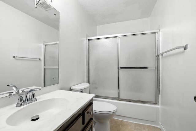1958 6th St N, North Saint Paul, MN 55109 - bathroom featuring vanity, combined bath / shower with glass door, and tile patterned floors
