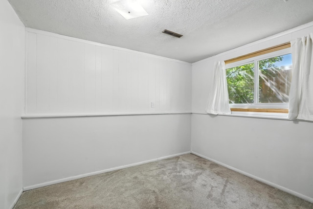1958 6th St N, North Saint Paul, MN 55109 - carpeted empty room with a textured ceiling and baseboards