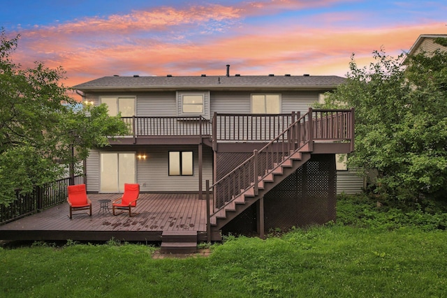 1318 Windcrest Ave, Eagan, MN 55123 - back of house at dusk featuring a deck and stairs