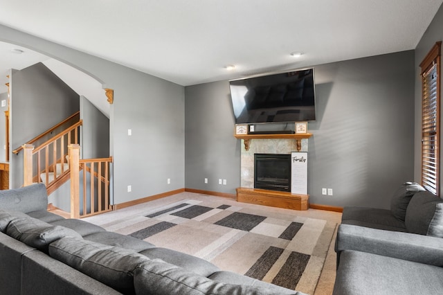 1222 81st Ct N, Brooklyn Park, MN 55444 - carpeted living room with a tile fireplace and stairway