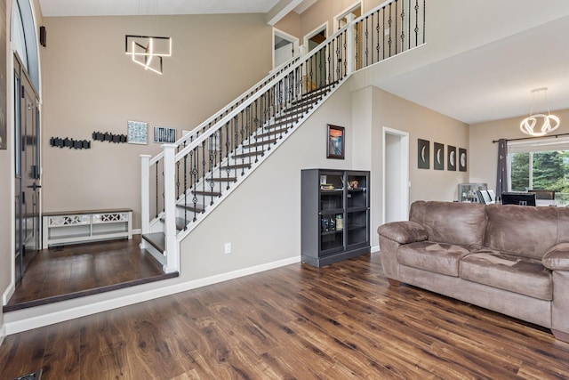 17964 Fresno St NW, Elk River, MN 55330 - living room with wood finished floors, stairs, a chandelier, and a towering ceiling
