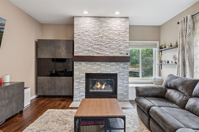 17964 Fresno St NW, Elk River, MN 55330 - living room with wood finished floors, a stone fireplace, and recessed lighting