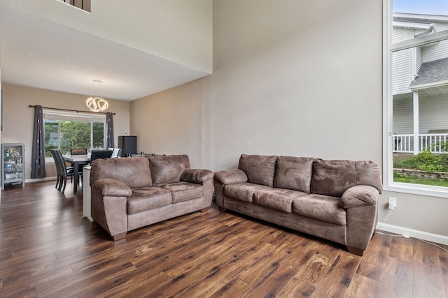 17964 Fresno St NW, Elk River, MN 55330 - living area with dark wood finished floors and a chandelier