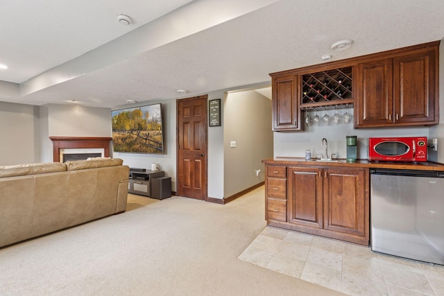 17964 Fresno St NW, Elk River, MN 55330 - indoor wet bar featuring dishwasher, a fireplace, light carpet, and recessed lighting