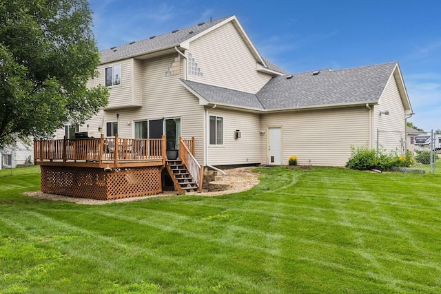17964 Fresno St NW, Elk River, MN 55330 - rear view of house with a wooden deck, a shingled roof, a lawn, and stairs