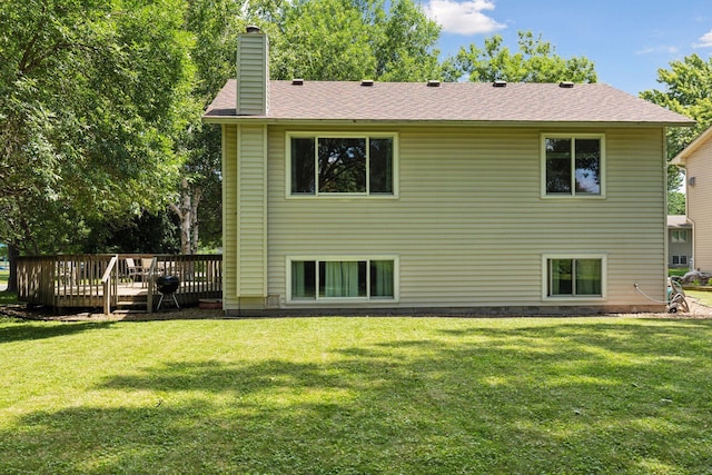 9743 Hemlock Ln N, Maple Grove, MN 55369 - back of property featuring a chimney, a wooden deck, and a yard