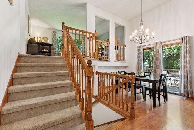 9743 Hemlock Ln N, Maple Grove, MN 55369 - stairway with wood finished floors and a chandelier