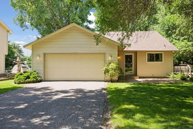 9743 Hemlock Ln N, Maple Grove, MN 55369 - view of front of property with asphalt driveway, an attached garage, a front lawn, and a shingled roof