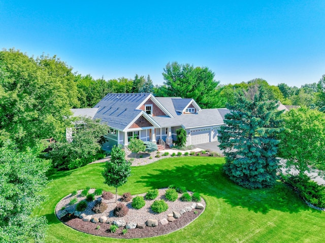 442 Wren Ln, Hudson, WI 54016 - craftsman house with an attached garage, a front lawn, driveway, and covered porch