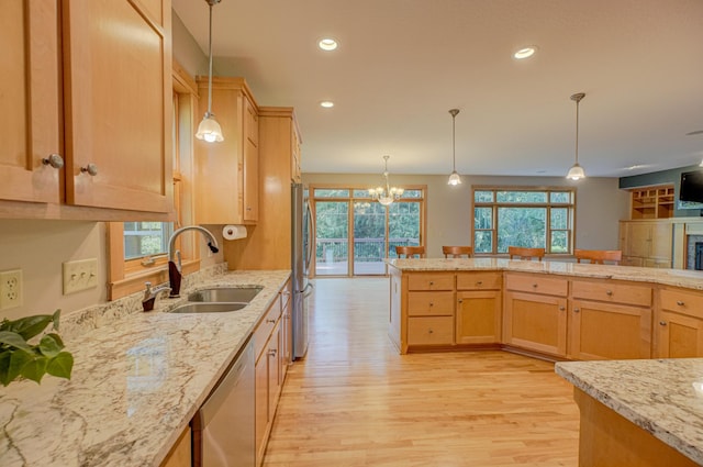 442 Wren Ln, Hudson, WI 54016 - kitchen featuring appliances with stainless steel finishes, light wood-type flooring, plenty of natural light, recessed lighting, and light brown cabinets