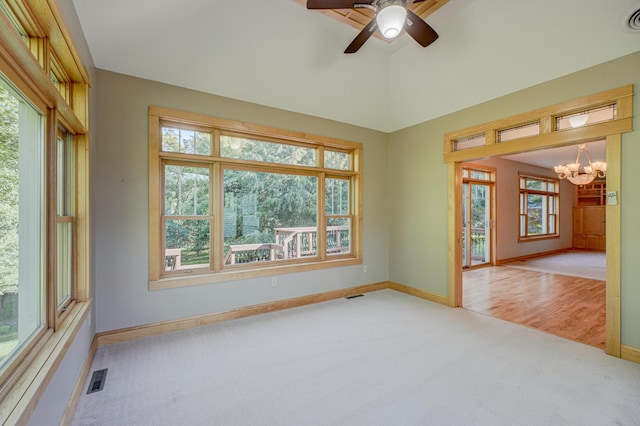 442 Wren Ln, Hudson, WI 54016 - spare room featuring carpet flooring, a chandelier, ceiling fan, and lofted ceiling