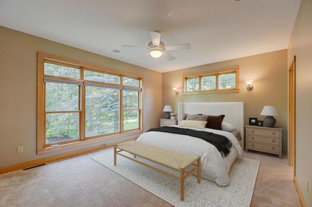 442 Wren Ln, Hudson, WI 54016 - bedroom with light colored carpet, multiple windows, and ceiling fan