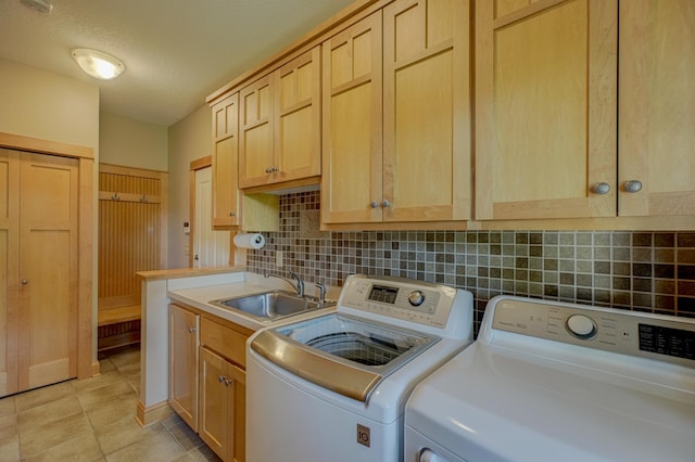 442 Wren Ln, Hudson, WI 54016 - laundry room featuring washer and dryer, cabinet space, light tile patterned floors, and a textured ceiling