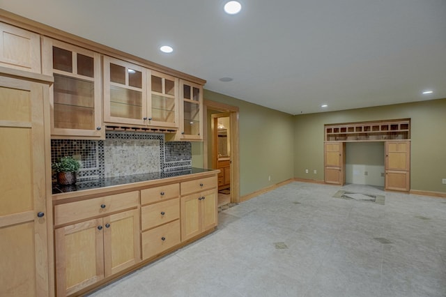 442 Wren Ln, Hudson, WI 54016 - kitchen featuring light brown cabinetry, tasteful backsplash, glass insert cabinets, and recessed lighting