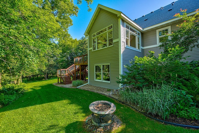 442 Wren Ln, Hudson, WI 54016 - view of green lawn with stairs, an outdoor fire pit, and a deck