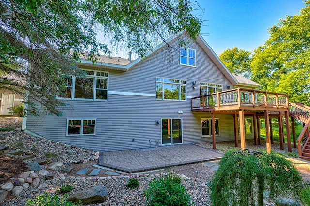 442 Wren Ln, Hudson, WI 54016 - back of property with stairway, a deck, and a patio