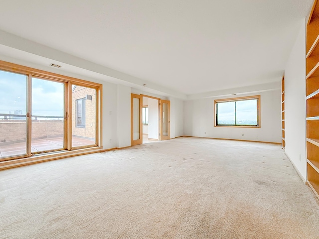 110 1st Ave NE Unit 1006, Minneapolis, MN 55413 - spare room with light colored carpet and baseboards