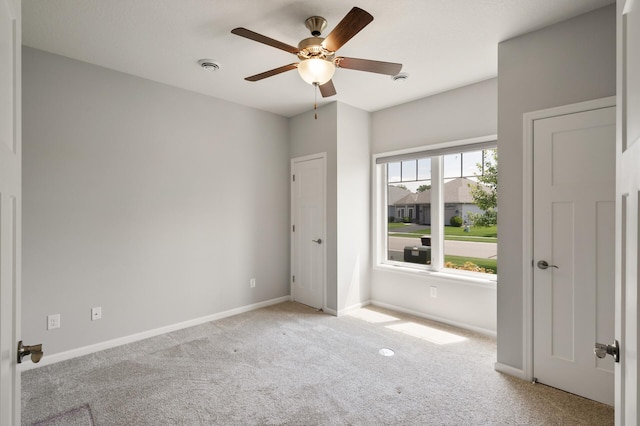 19400 75th Ave, Corcoran, MN 55340 - carpeted empty room with a ceiling fan and baseboards