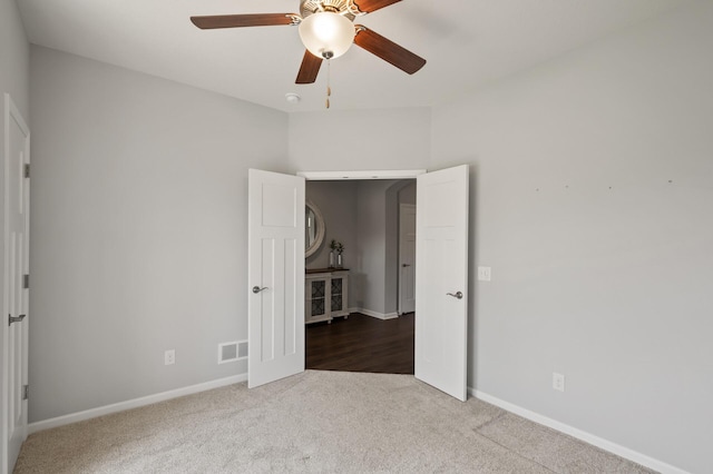 19400 75th Ave, Corcoran, MN 55340 - unfurnished bedroom with carpet and a ceiling fan