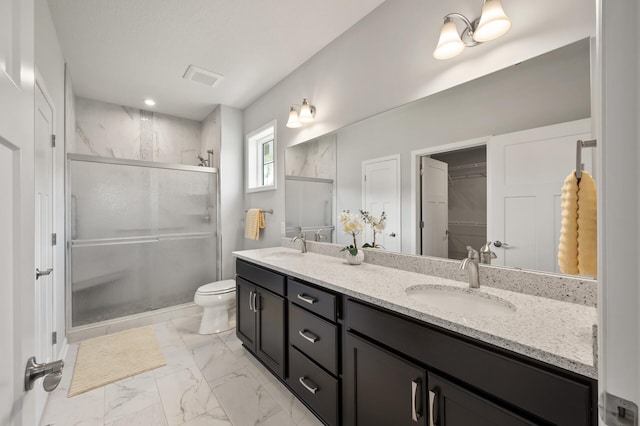 19400 75th Ave, Corcoran, MN 55340 - bathroom with double vanity, marble look tiles, a stall shower, and a spacious closet