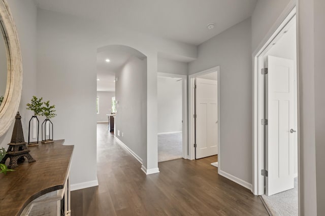 19400 75th Ave, Corcoran, MN 55340 - hallway with arched walkways, dark wood finished floors, and recessed lighting