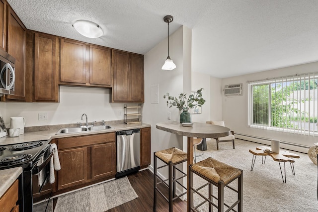 3729 Snelling Ave Unit 108, Minneapolis, MN 55406 - kitchen with stainless steel appliances, baseboard heating, dark wood finished floors, a textured ceiling, and hanging light fixtures