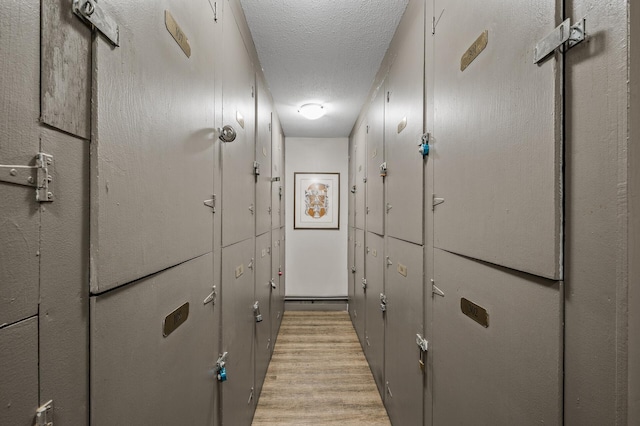 3729 Snelling Ave Unit 108, Minneapolis, MN 55406 - corridor with a textured ceiling and light wood finished floors
