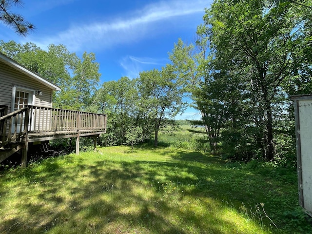 21344 County Road 11, Crosby, MN 56441 - view of green lawn featuring a wooden deck