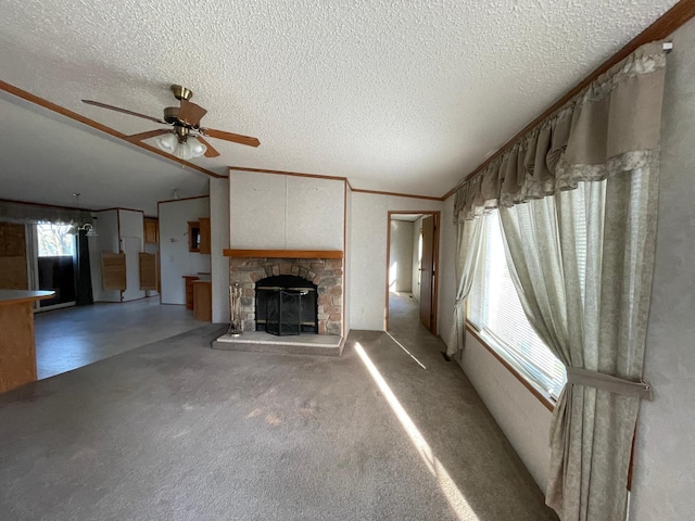 21344 County Road 11, Crosby, MN 56441 - unfurnished living room featuring vaulted ceiling, a textured ceiling, ceiling fan, a fireplace, and carpet