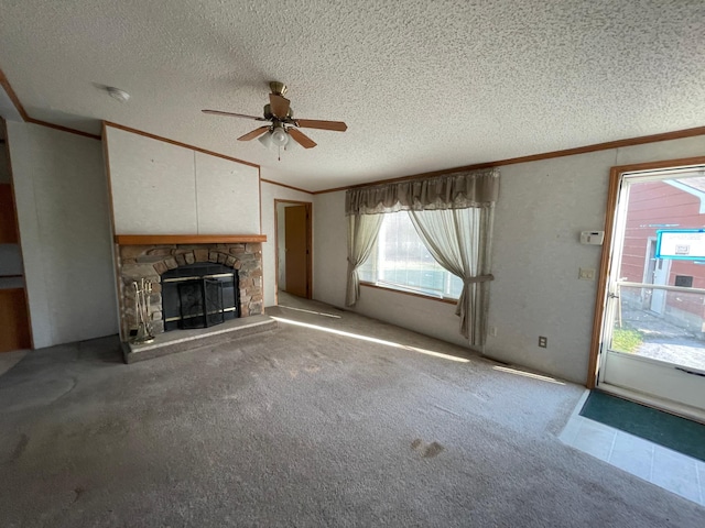 21344 County Road 11, Crosby, MN 56441 - unfurnished living room featuring crown molding, a ceiling fan, a textured ceiling, a fireplace, and carpet flooring