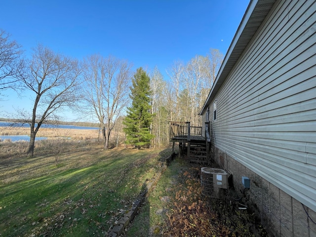 21344 County Road 11, Crosby, MN 56441 - view of green lawn with a deck with water view and stairs