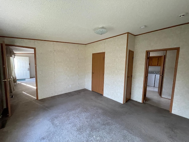 21344 County Road 11, Crosby, MN 56441 - unfurnished bedroom with independent washer and dryer, crown molding, a textured ceiling, and carpet