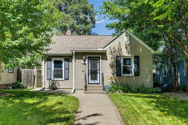 1821 Orange Ave E, Saint Paul, MN 55119 - view of front of property featuring stucco siding, a chimney, and a shingled roof