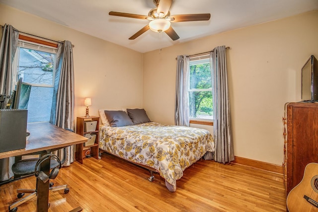 1821 Orange Ave E, Saint Paul, MN 55119 - bedroom featuring light wood finished floors and ceiling fan
