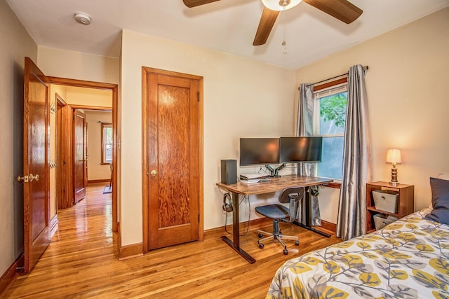 1821 Orange Ave E, Saint Paul, MN 55119 - bedroom featuring light wood finished floors, an office area, and ceiling fan