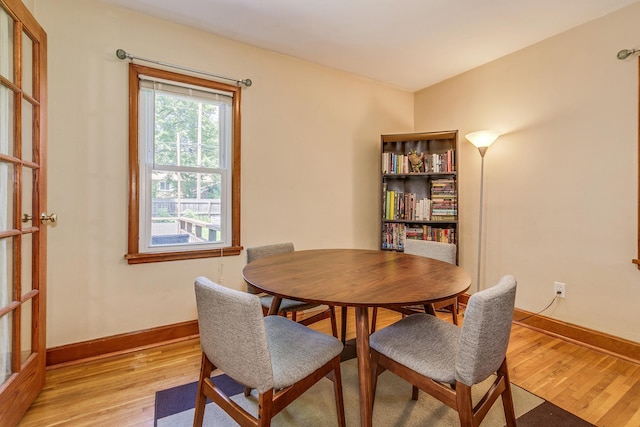 1821 Orange Ave E, Saint Paul, MN 55119 - dining area featuring light wood-type flooring and baseboards