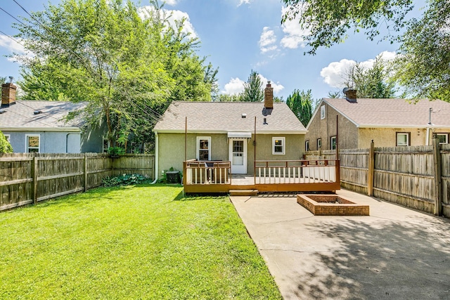 1821 Orange Ave E, Saint Paul, MN 55119 - back of property with stucco siding, a deck, a fenced backyard, and a patio area