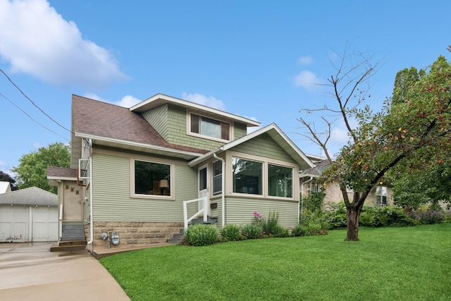 116 9th Ave NW, Rochester, MN 55901 - bungalow-style home featuring a detached garage, entry steps, a front lawn, and roof with shingles