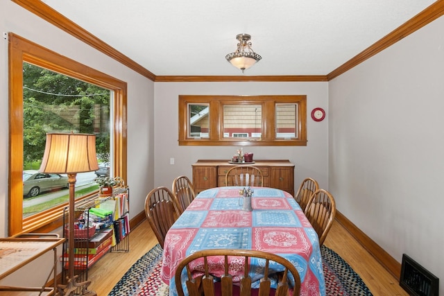 116 9th Ave NW, Rochester, MN 55901 - dining room with light wood-type flooring and ornamental molding
