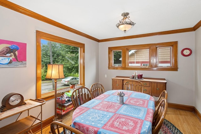 116 9th Ave NW, Rochester, MN 55901 - dining area with light wood-style floors and crown molding